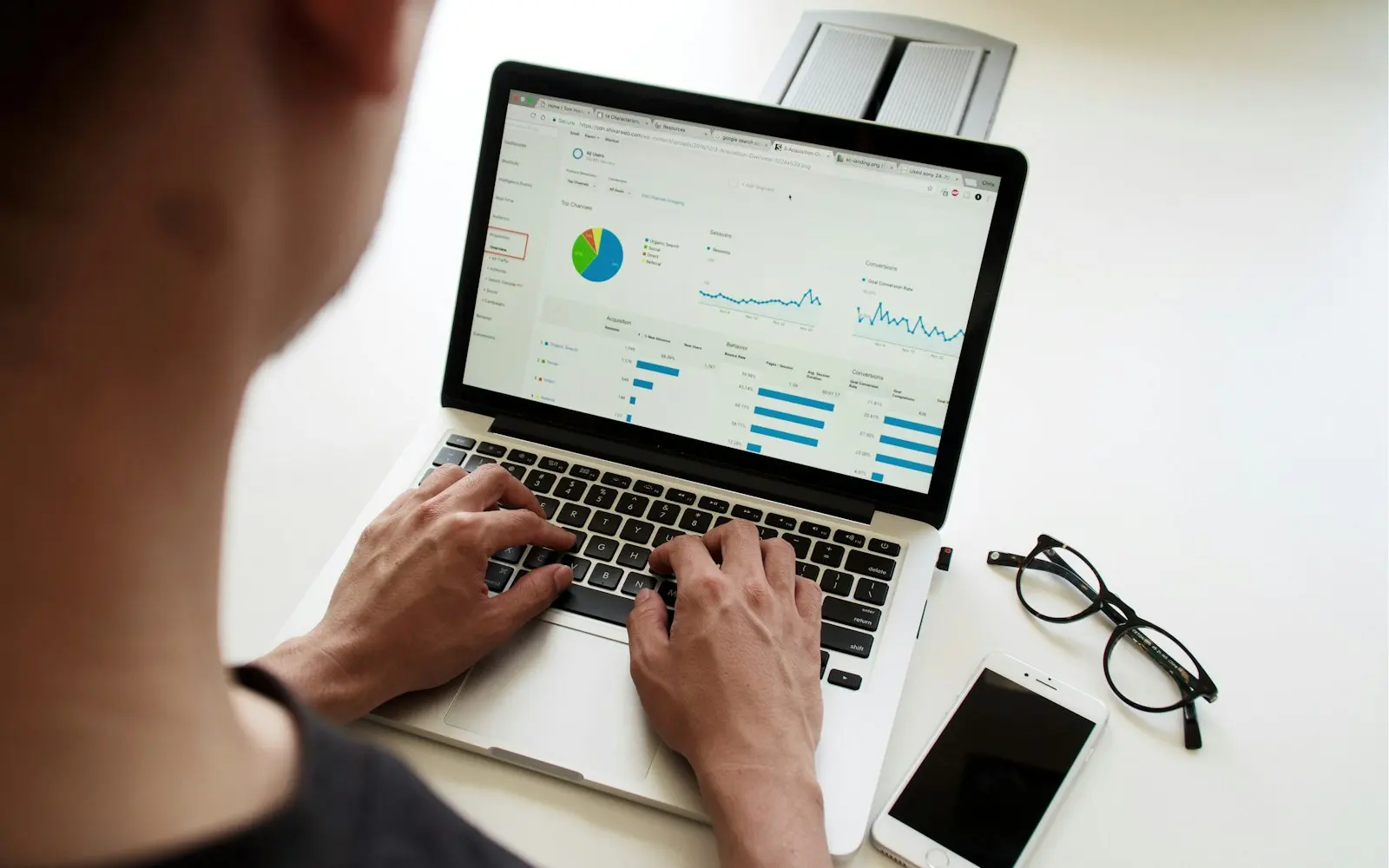 Reviewing hiring metrics on a laptop
