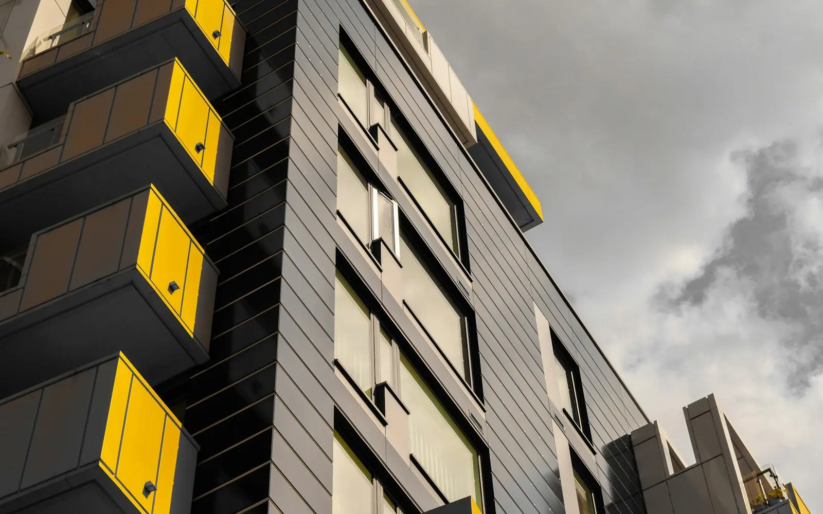 Commercial building under a cloudy sky