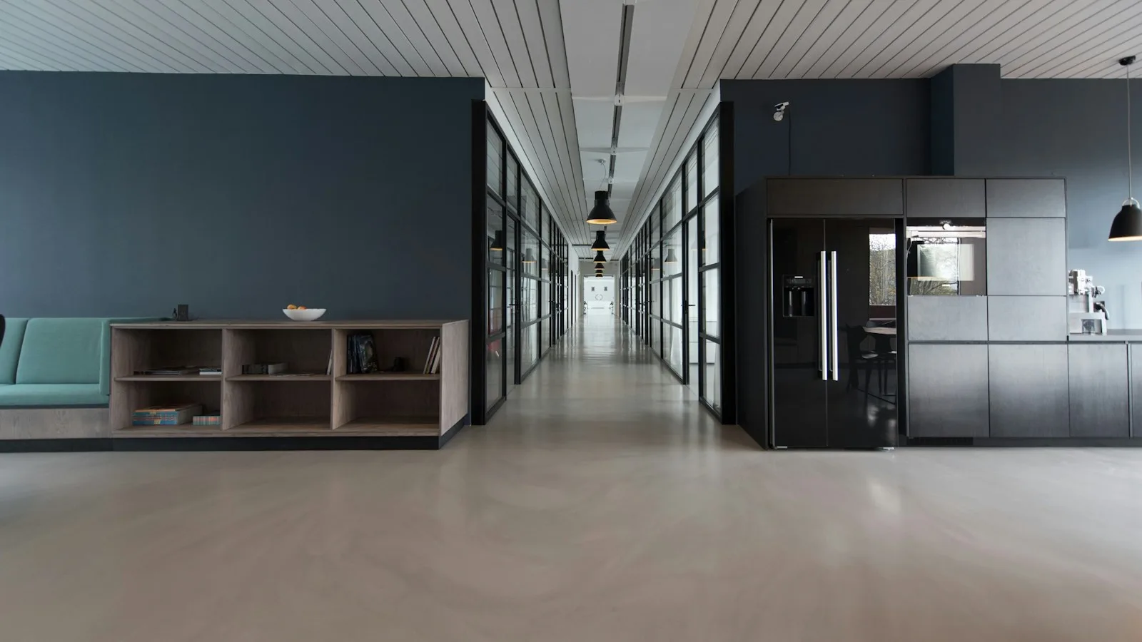 Bright office lounge and glass meeting rooms