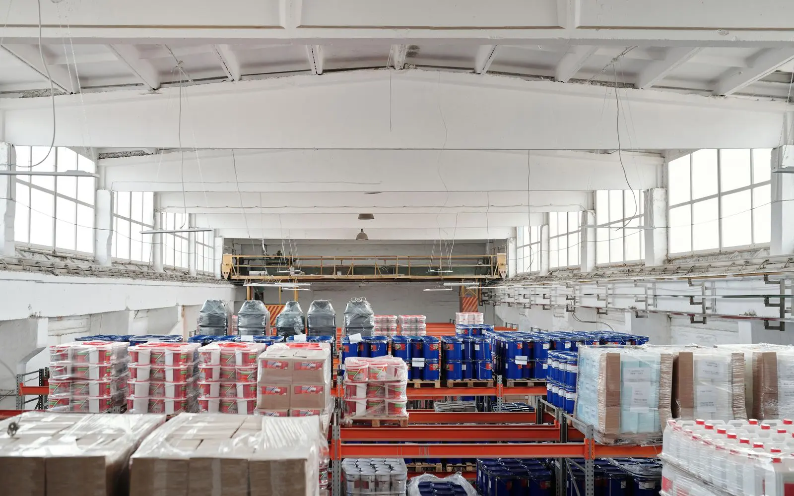 Palletized goods on racks in a bright warehouse