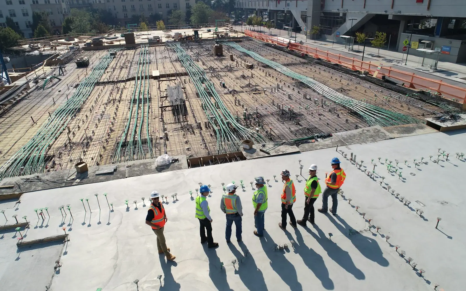 Construction crew reviewing a foundation pour